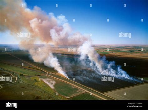 Agriculture Aerial View Of A Field Of Grain Stubble Being Burned