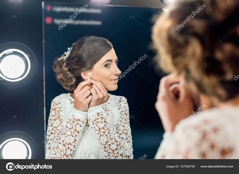 Woman Wearing Earrings — Stock Photo © Igorvetushko 167526756