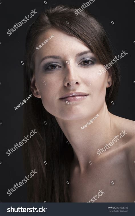 Portrait Of A Beautiful Naked Woman With Brunette Hair And An Enigmatic