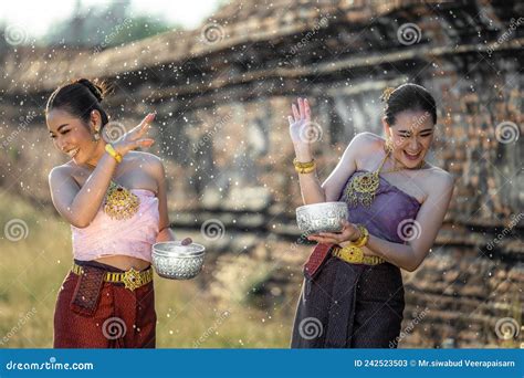 thai girls splashing water during festival songkran festival beautiful thai woman wearing thai