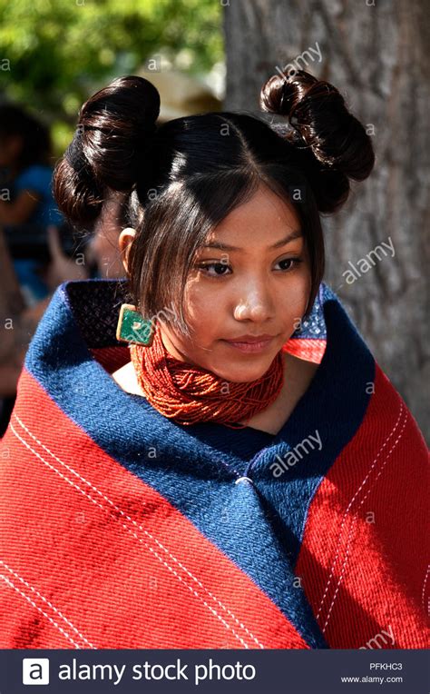 When you think of an indian, you usually imagine them wearing their hair in braids. A young Native American (Hopi) woman wearing traditional ...