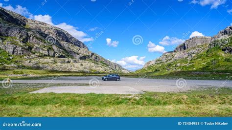 Beautiful Norwegian Landscape In The Mountains Single Car Parked In
