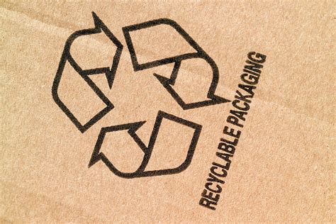 Recycling Symbol Cardboard Photograph By Simon Fraser Science Photo