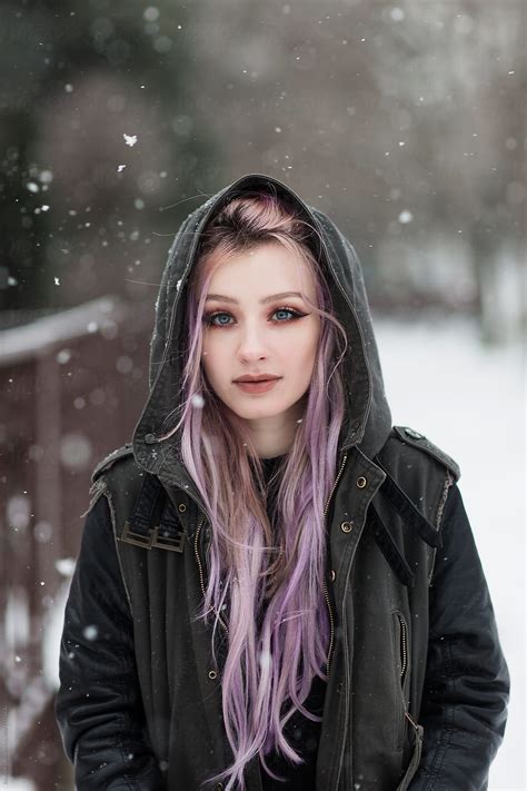 Portrait Of A Beautiful Young Woman With Pink Hair On Snow Del