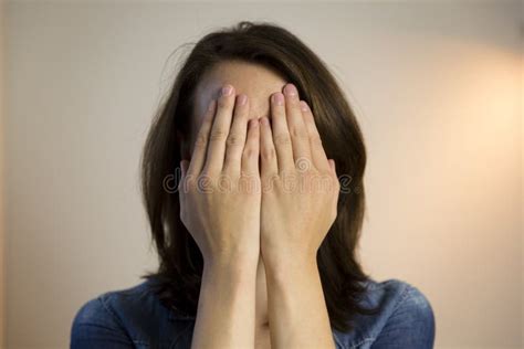 Girl Hiding Face Behind Her Hands Stock Photo Image Of Covering
