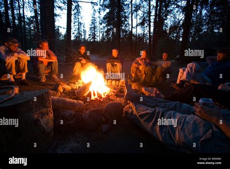 Group Sitting Around Campfire Idaho Stock Photo Alamy