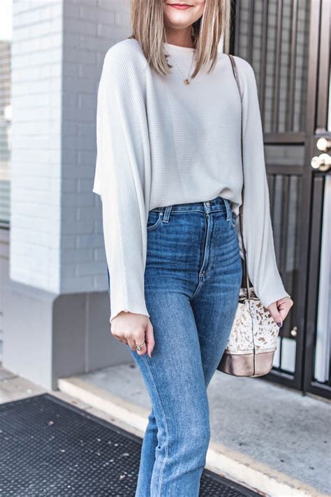 Wearing A 23 Ribbed Knit Amazon Top Paired With Paige Jeans And White Heeled Mules Skirt