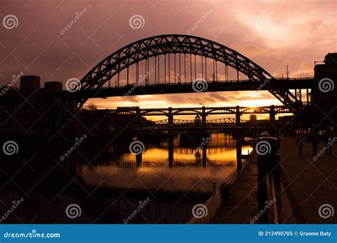 Tyne Bridge At Sunset In Silhouette With Reflection On River Stock