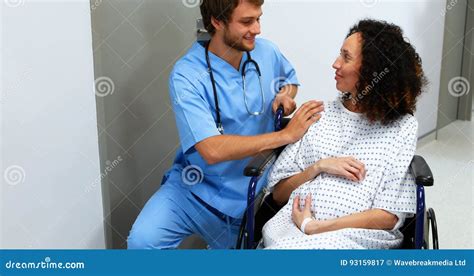 Doctor Comforting Pregnant Woman In Corridor Stock Video Video Of