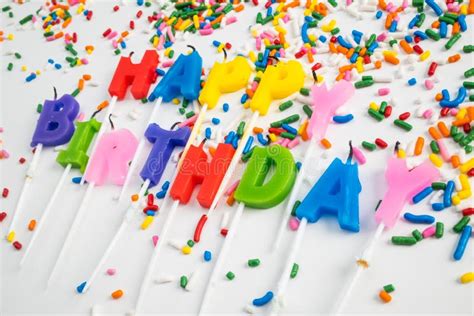Happy Birthday Letter Candles On A White Background With Sprinkles