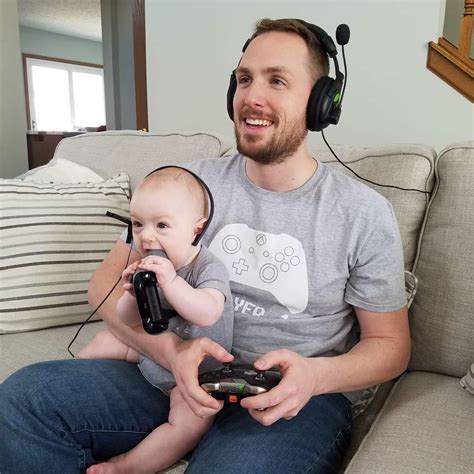 my best bud and his 6 month old son playing video games together sort of r funny