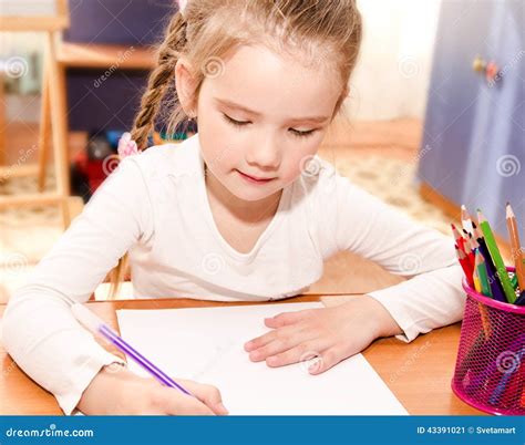 Cute Little Girl Is Writing At The Desk Stock Image Image Of Copybook