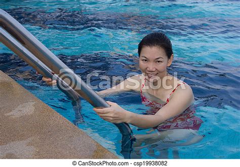 Portrait Of Asian Woman Getting Out Of A Swimming Pool Canstock
