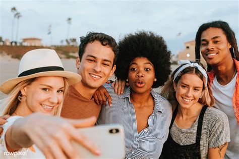 Group Of Diverse Friends Taking A Selfie At The Beach Premium Image