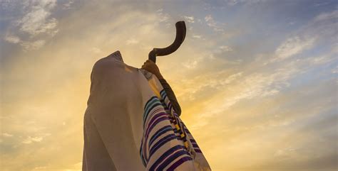 Blowing The Shofar Man In A Tallith Jewish Prayer Shawl Is Blowing