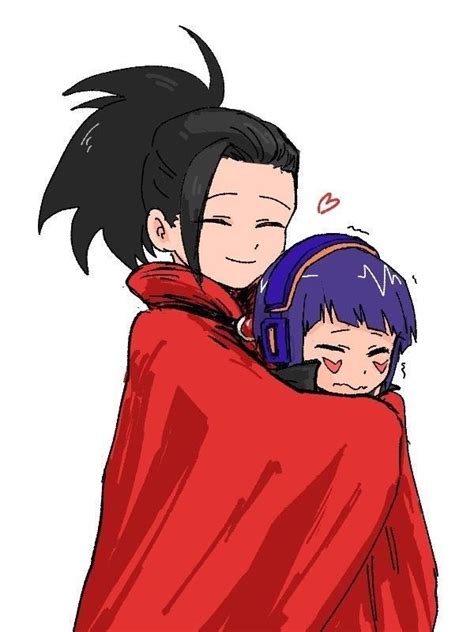 An Image Of Two People Wrapped In A Blanket And One Is Hugging The