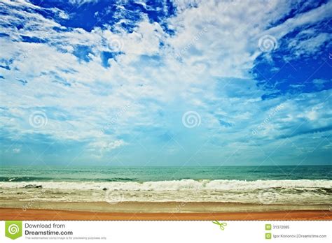 Sand Beach Ocean And Cloudy Sky Stock Image Image Of Coast Outdoors