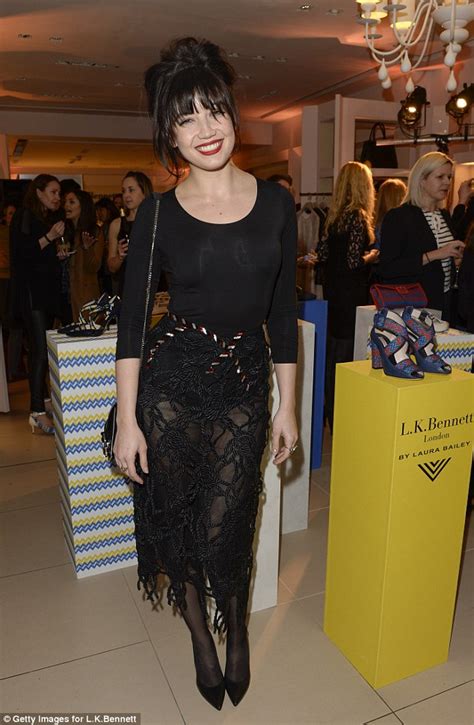 daisy lowe draws attention to her shapely legs in sheer skirt as she attends fashion launch in
