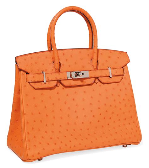 When viewed from a perpendicular angle, the illusion of relief is deliciously disconcerting. AN ORANGE OSTRICH 'BIRKIN' BAG