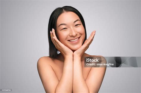 Cheerful Ethnic Woman With Hands Under Chin Stock Photo Download