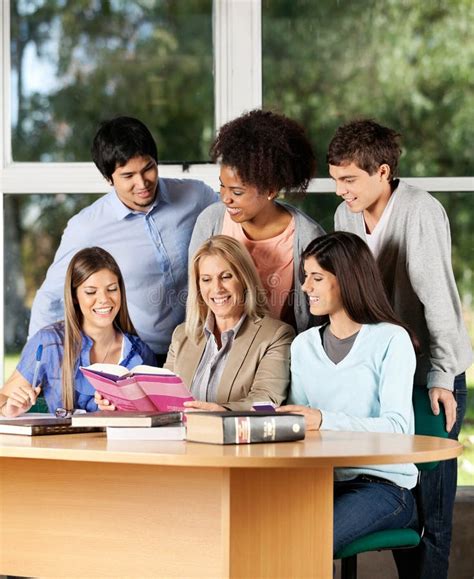 College Teacher Explaining Lesson To Students In Stock Image Image Of