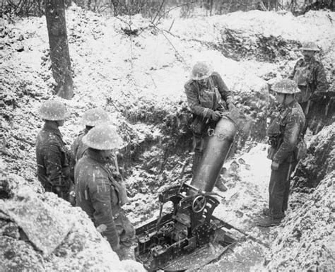 A British 945 Inch Trench Mortar Crew Stand With Their Weapon In An
