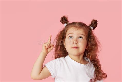 Portrait Surprised Cute Little Toddler Girl Child Over Pink Looking