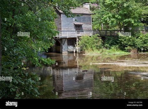 Old Grist Mill Wooden Reflected In Water Stock Photo Alamy