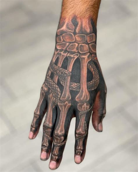 32 Creepy Cool Skeleton Hand Tattoos
