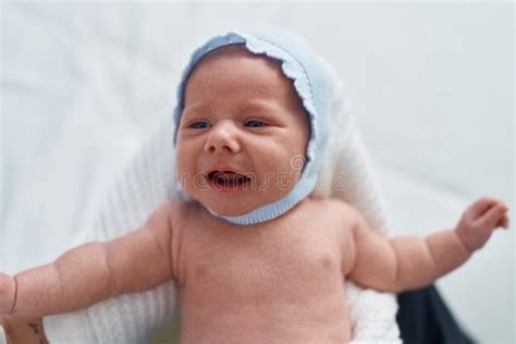 Adorable Caucasian Baby Crying On Mother Arms At Bedroom Stock Image