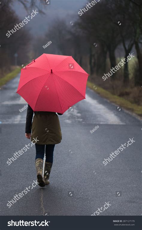 Rainy Day Woman Holding Red Umbrella Stock Photo Edit Now 287127179