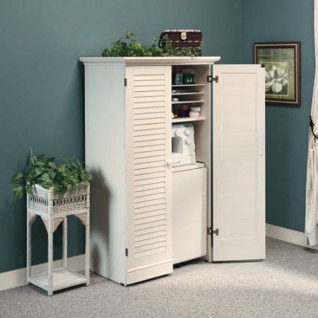 It has ample storage but can be closed when not in use. Amazon.com: Craft / Sewing Machine Cabinet Storage Armoire ...