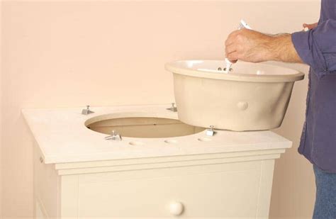 Attach flexible water supply lines to the base of the. How to Install a Bathroom Sink | HomeTips