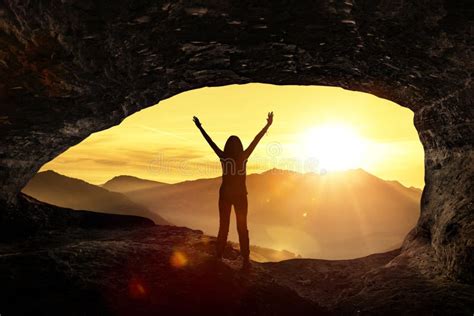 Woman Welcomes The Sunrise In A Cave Stock Image Image Of Success