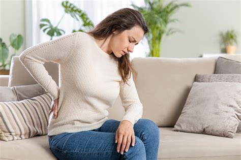 Young Woman Suffering With Back Pain Stock Photo Download Image Now