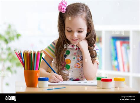 Cute Little Preschooler Child Drawing At Home Stock Photo Alamy
