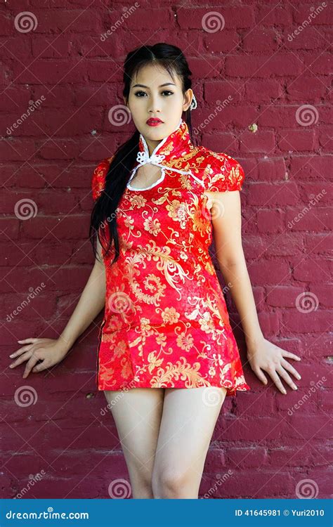 Chinese Girl In Traditional Chinese Cheongsam Blessing Stock Photo