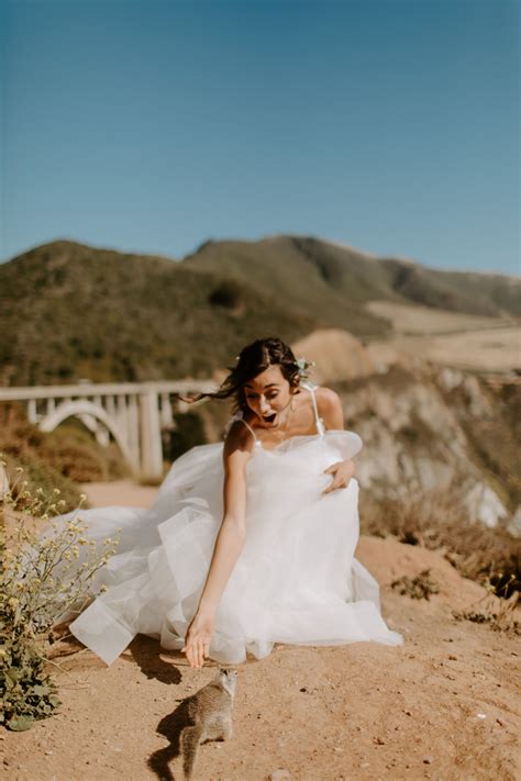 Beach wedding centerpieces comprised of glass hurricane vases filled with sand, shells, and pillar candles. This Pfeiffer Beach Wedding Focused on Intimacy and the ...