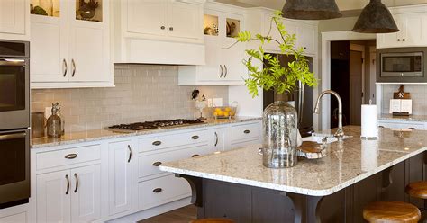 The top of the cabinet has a vinyl top that has a marble appearance. View this graceful open-plan kitchen | Showplace Cabinetry