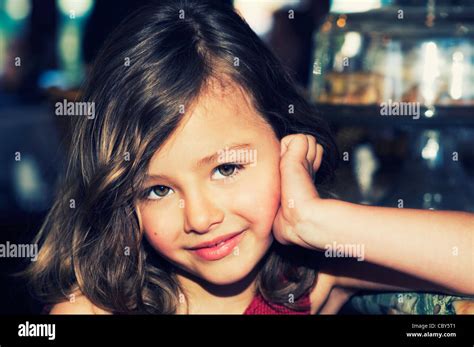 Cute Portrait Of A Young 5 Year Old Brunette Girl Smiling With Big