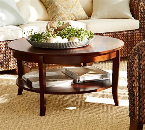 Small round coffee table with gold gilt base and pink marble top. Chloe Round Coffee Table | Pottery Barn