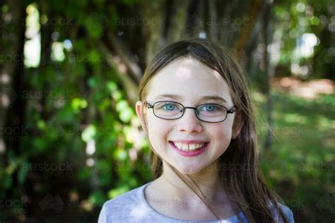 Image Of Young Girl Wearing Glasses In Dappled Light Austockphoto