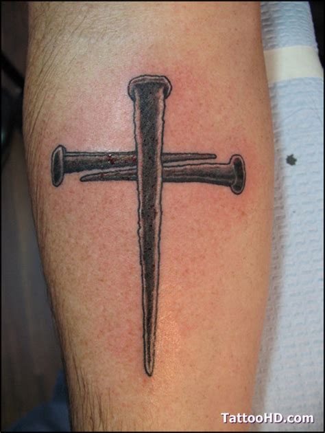 From a cross tattoo on the chest, arm, shoulder, back, sleeve. Nail Cross With Crown Of Thorns Tattoo