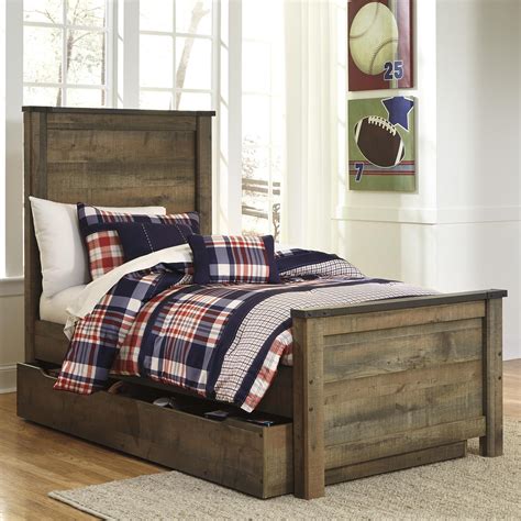 signature design by ashley trinell rustic look twin panel bed with under bed storage trundle