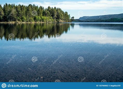 A Quiet Peaceful Summer Morning With View Over Crystal Clear Calm Lake