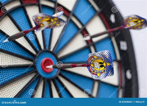 Dart With A Grinning Emoticon Hit Bullseye With The Emoticon In Focus