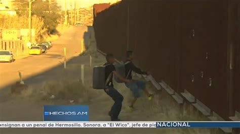 Video Catches Two Suspected Mexican Drug Smugglers Climbing Over Border