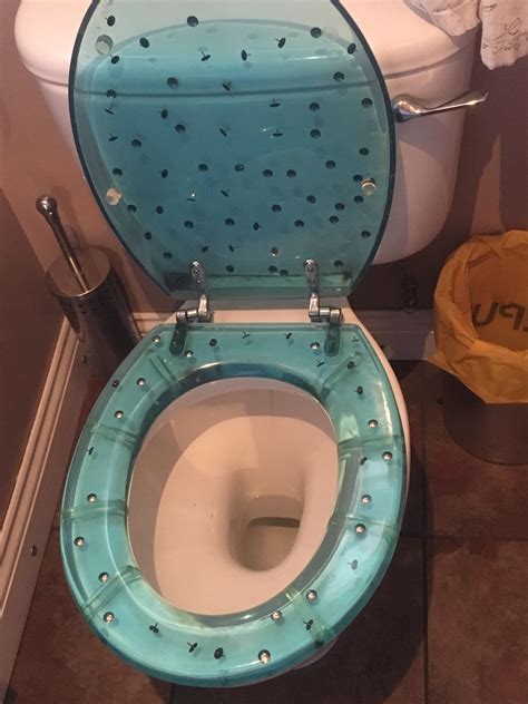 The angle between the seat and the bowl needs to be beyond 90 degrees or it will fall down. Thumbtack toilet seat : ATBGE
