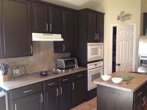 Espresso Beans by Behr. We painted our lightly stained oak cabinets in