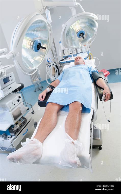 Patient Lying Down On An Examination Table Hi Res Stock Photography And